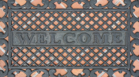 top view of the welcome exterior floor plastic mat on the orange brick floorの写真素材