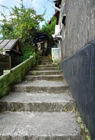 concrete outdoor staircase leading to local house in old town of Taiwanの写真素材