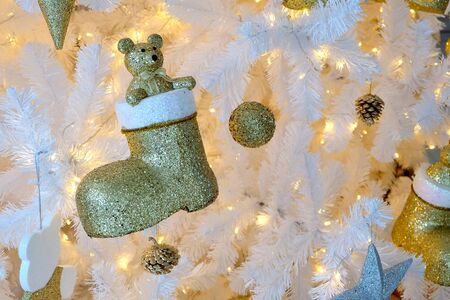 Christmas decoration on white christmas tree with lightingの写真素材