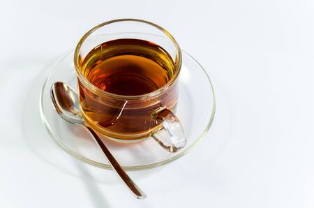 Hot tea in transparant cup with white backgroundの写真素材
