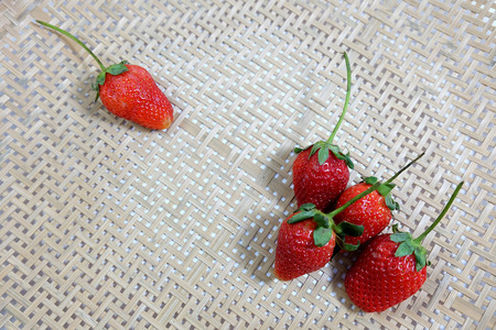 fresh strawberry on woven basket with white backgroundの写真素材