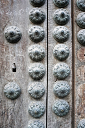 rustic metal ornamnetal decoration on the door panel in Spain