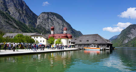 Berchtesgaden, Germany - 5 May,2016 : Tourist walking to St. Bartholoma with Watzmann background at Konigssee on 5 May 2016 in Berchtesgaden , Germanyのeditorial素材
