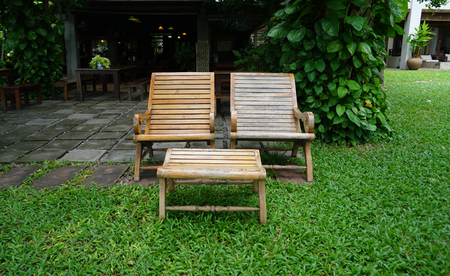 outdoor reclining timber benches in the tropical gardenの写真素材