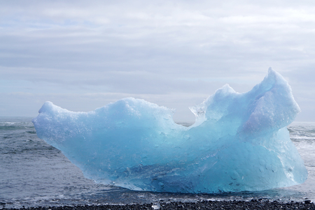 iceburg on the black rock beach in Icelandの写真素材