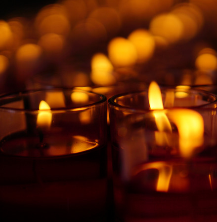 Blurred orange color bokeh effect with black backgroundの写真素材