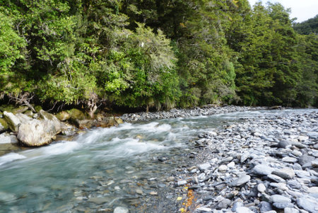 Beautiful landscape of Hokitika Gorge in New Zealand with mountain range background