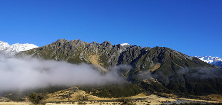 Low level of cloud with high mountain range background in New Zealand in may
