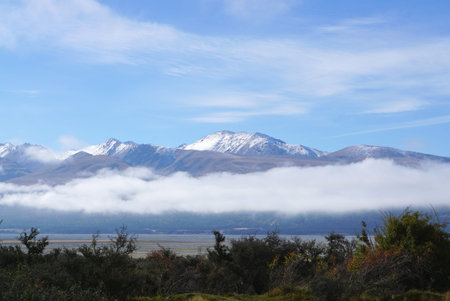 Low level of cloud with high mountain range background in New Zealand in may
