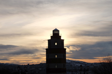 Murmansk, Russia - 3 November,2017 : Memorial lighthouse with sunrise background background on the hill in Murmansk on 3 November 2017  in Murmansk, Russiaのeditorial素材