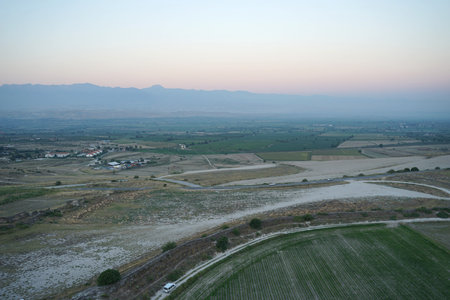 Bird eye view of the beautiful white Travertines terrace of Pamukkale landscape from hot air balloon...