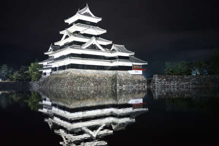 Matsumoto, Japan - 19 October, 2019 : Beautiful black and white of Matsumoto castle with bright light at night on 19 October, 2019  in Matsumoto, Japanのeditorial素材