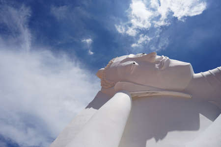 Phra Nakhon Si Ayutthaya , Thailand - 20 June, 2020 : The white large reclining Buddha sculpture outdoor with beautiful sky in Wat Satue 20 June, 2020 in Phra Nakhon Si Ayutthaya , Thailandのeditorial素材