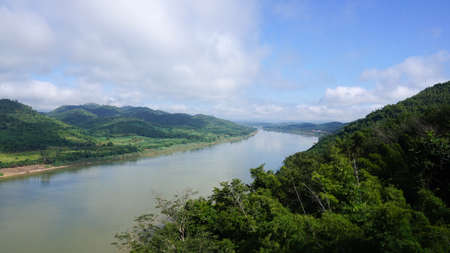Green Mountain range and Khlong river at the border of Laos from the view point of Chaing Kkhan skywalk, Loei Province , Thailandの写真素材