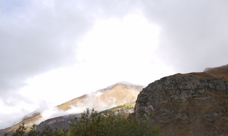 Beautiful autumn mountain landscape of the Caucasus mountain range on the way to Kazbegi, Georgia.の写真素材
