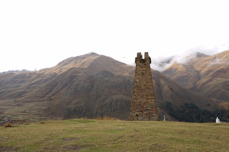 Beautiful autumn mountain landscape of the Caucasus mountain range at Sioni Basilica in Kazbegi, Georgia.の写真素材