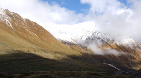 Beautiful autumn mountain landscape of the Caucasus mountain range on the way to Kazbegi, Georgia.の写真素材