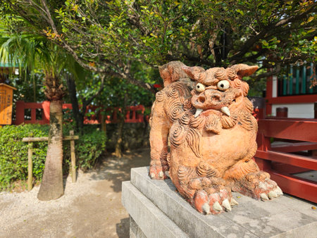 Close up of traditional Shisa lion dog sculpture of Okinawa island decoration on the fence of the house of temple in Okinawa, Japanの写真素材