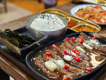 Traditional Korean Soy Marinated Raw Salmon set serving with steamed rice and seaweed.の写真素材