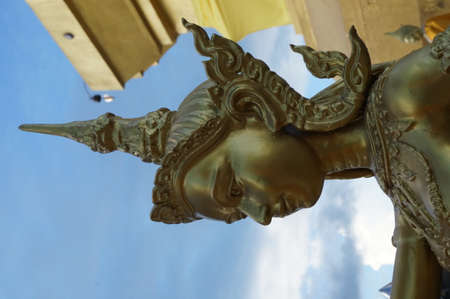 Side of golden goddess under the blue skyの写真素材