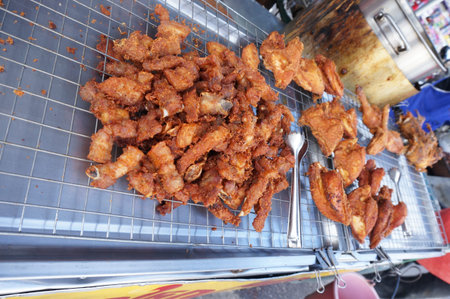 Thai food, pork and chicken fritters for sale at a stall in the  market