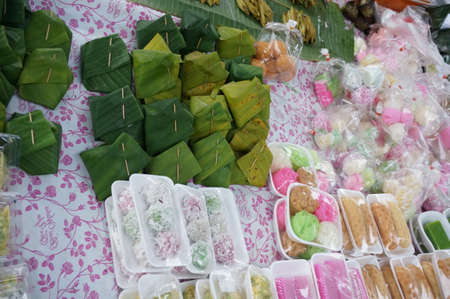 A Stall of Thai sweet desserts in the market at the rural of Thailandの写真素材