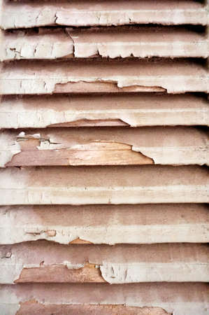 Wooden   lath window with old peeling paint texture backgroundの写真素材