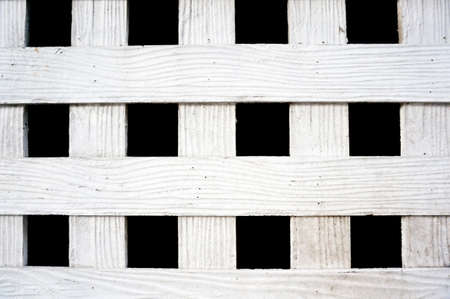 Vintage photo of white wood lath texture isolated on black background, close upの写真素材