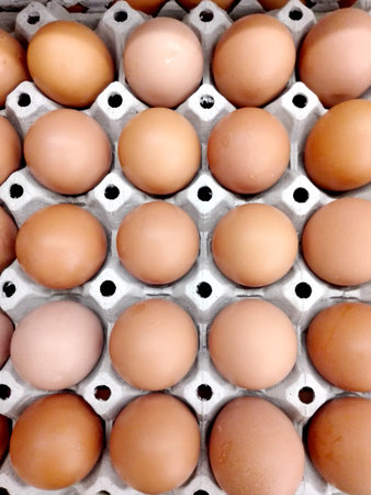 A photo of fresh eggs background  in box for sale at a market