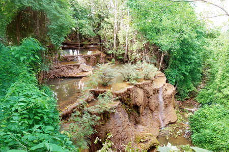 Waterfall in the forest flown through rock rushing over the stones in the forest at Huay Mae Khamin Waterfall, Kanchanaburi, western of Thailandの写真素材
