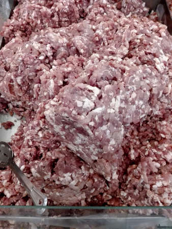Fresh raw pork minced meat for sale in a marketの写真素材