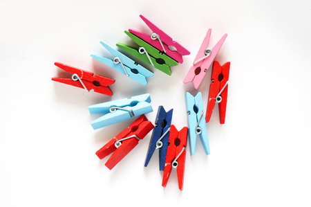 Various color of wooden clothespins isolated on white backgroundの写真素材