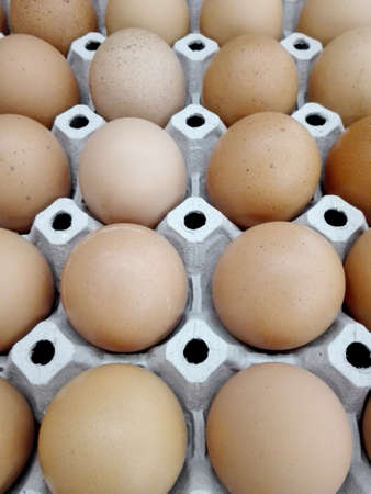 A photo of fresh eggs background on panel for sale at a marketの写真素材