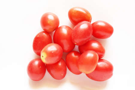 Close up of photo of very fresh colorful tomatoes isolate on white backgroundの写真素材