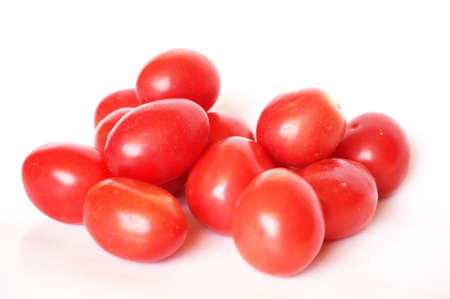 Close up of photo of very fresh colorful tomatoes isolated on white backgroundの写真素材