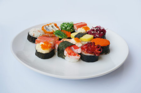 Asia - Asian eating food, Japanese food, sushi set in plastic box isolated on white background, close up.の写真素材
