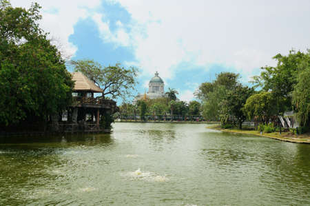 A photo of landscape of a pond at public park with Ananta Samakhom Throne Hall in scenery under the blue sky, Thailandの写真素材