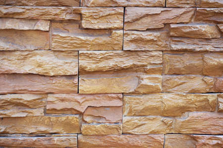 A photo of brick stone wall texture background, close upの写真素材