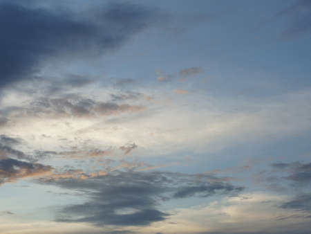 A photo of evening cloudy sky with dark cloud on sunsetの写真素材
