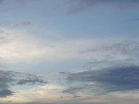 A photo of evening cloudy sky with dark cloud on sunsetの写真素材