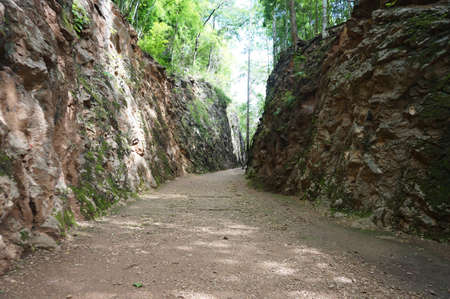 A photo of landscape of walkway in the mountain at Hellfire Pass: this walkway has used since World War II. Its destination is the abandon railway built by Allied prisoner at Kanchanaburi, Thailandの写真素材