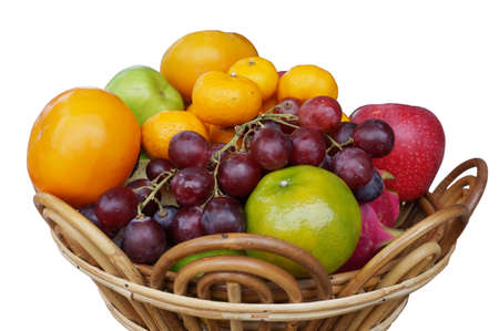 A photo of fresh mixed fruits for eat, grape, apple, orange, dragon fruit, melon and persimmon isolated on white background, close upの写真素材