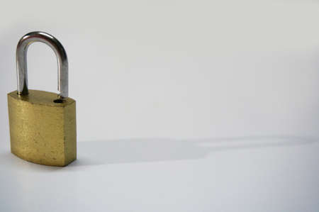 Photo of brass padlock isolated on white background, close upの写真素材