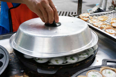 Hand making Thai dessert made from coconut milk, sometimes call Thai coconut pudding.の写真素材