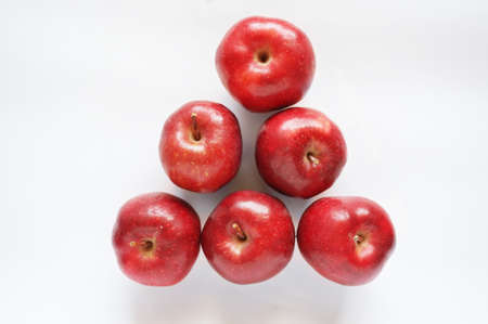 Close up of photo of very fresh red apples isolate on white backgroundの写真素材