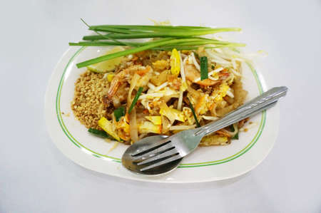 Asia-Asian food, Thai food, Pad Thai Goong Sod: Stir Fried Rice Noodle with Shrimp, lime and spring onion isolated on white backgroundの写真素材