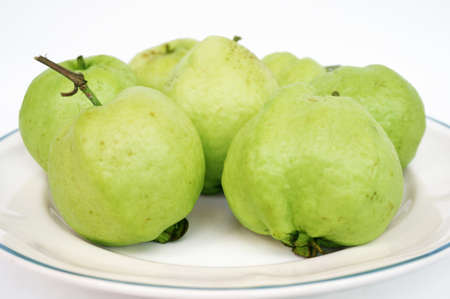 Close up of photo of very fresh green common guava (Psidium guajava) on white isolated on white backgroundの写真素材