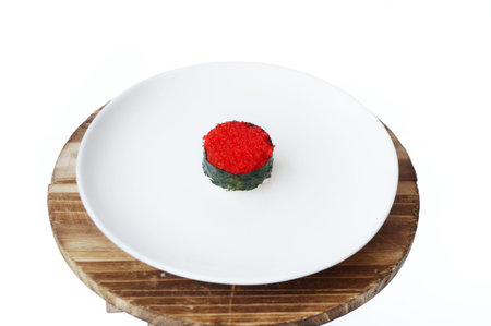 Asia - Asian eating food, Japanese food, Flying fish roe seaweed sushi on white plate  isolated on...