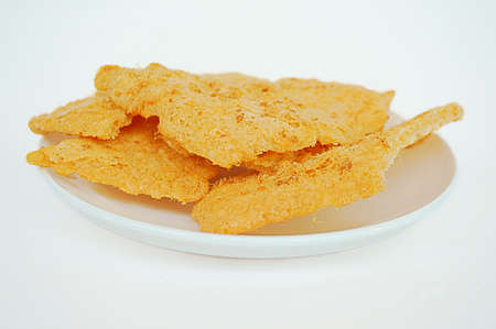 Asia-Asian, Thai food: a photo of Dried shredded flossy pork Rice cracker on white plate isolated on white background, close upの写真素材
