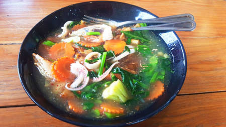 Asia - Asian eating food, Thai food, a Noodles in Thick Gravy with Seafood (Rad Na Ta Lay), close upの写真素材